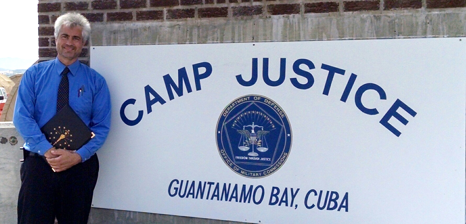 Jeff Papa stands at the entrance of Guantanamo Bay. (Submitted photo)