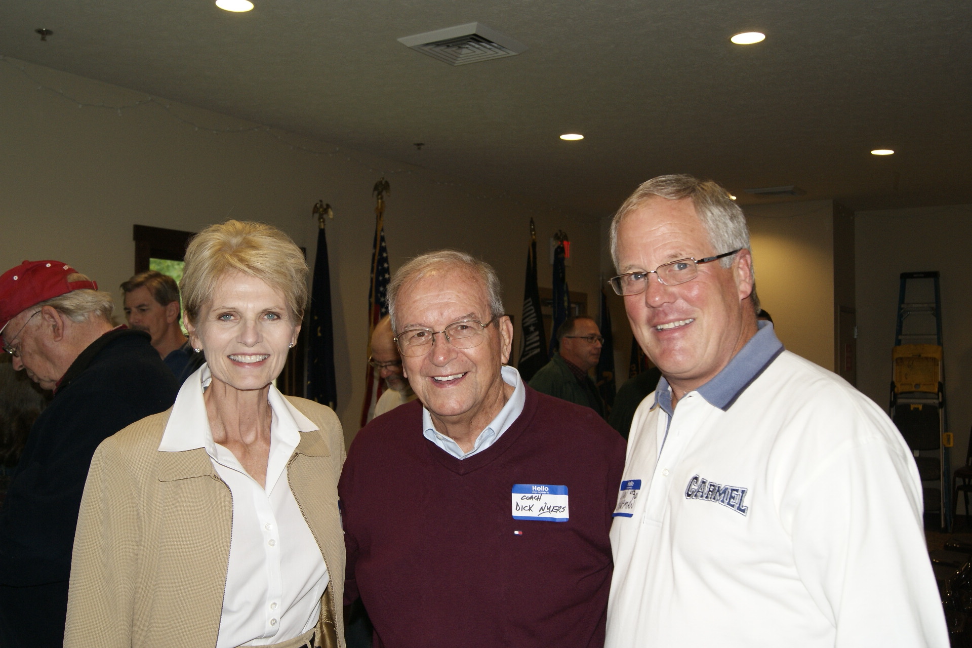 Former Carmel High School football coach Dick Nyers (center) with book authors Pam Otten and Dan Chapman. (Submitted by Michael Easterday)