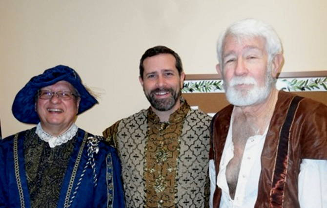 (From left to right) Chris Velonis, Ernie Mudris and Mike Hackett dress in their madrigal attire. (Photo by Steven Aldrich)