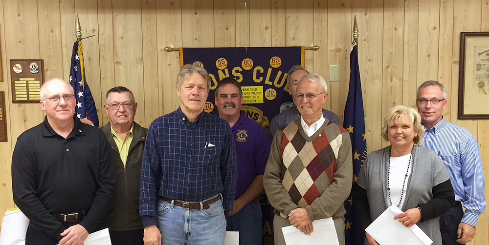 From left, front row: The four new Westfield Lions Club members are Randy Picek, Al Fennewald, Don Collins and Susan Clark. Behind them are their sponsors, Ted Engelbrecht, Brian Abraham, Ron Perkins and Jeff Larrison. (Submitted photo)