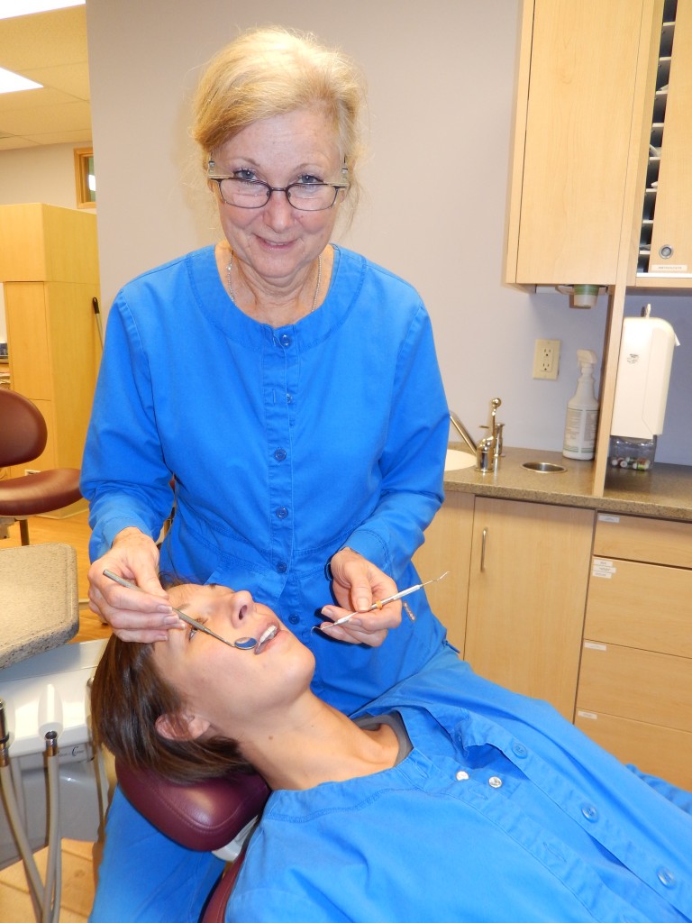 Glenda McCabe works on a patient. (Photo by Donna Monday)
