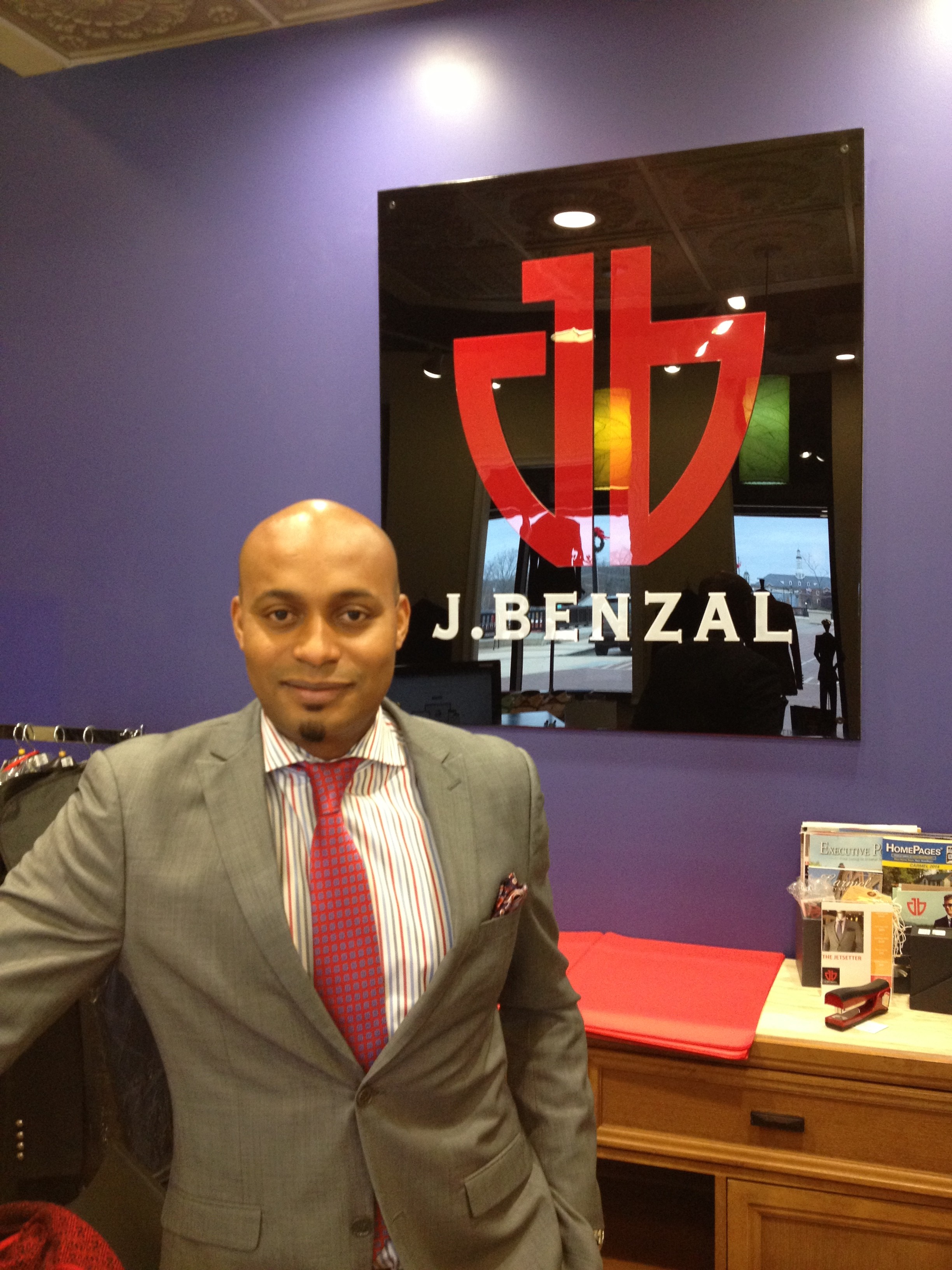 JBenzal owner designer Mamadou Ben Diallo in front of store sign e1418693173229