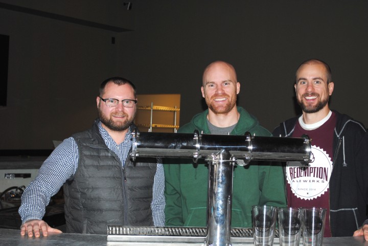 From left, Josh Smith, Ben Smith and Brandon Smith behind Redemption Alewerks. (Photo by Mark Ambrogi)