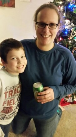 Melanie Tauber (right) with her son, Nathan High (left), holding a soda as comic relief to her 2015 resolution.