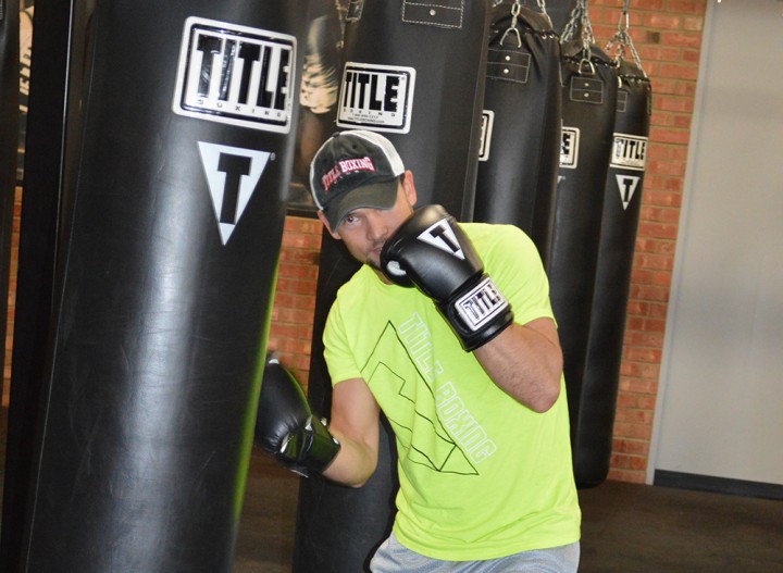Chris Jordan, general manager of the Title Boxing Club in Fishers demonstrates boxing techniques. (Photo by Beth Taylor)