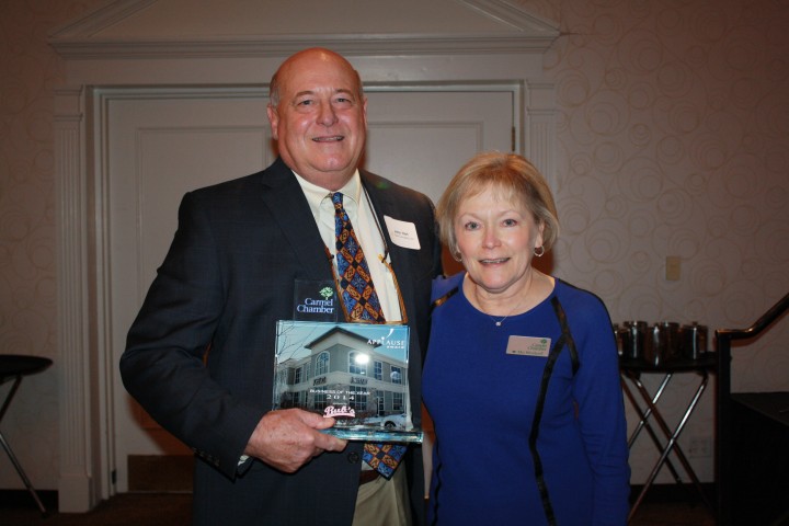 John Hart receiving the award Carmel Chamber of Commerce president Mo Merhoff. (Submitted photo)