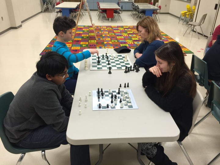 Gokul Srinivasan, Emily Yearling, Sam Solidly, and Susan Yearling at the Chess Club, part of the Chess Titans team. (Photo by Steven Aldrich)