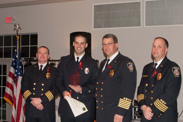 From left Deputy Chief Jeff Beam, Justin Pataky (holding his award), Fire Chief James VanGorder and Deputy Chief Brian Miller. (Submitted photo)
