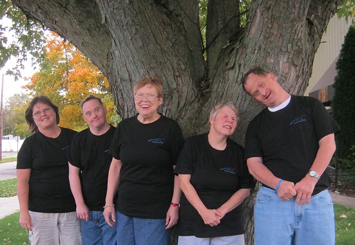 The Arc of Greater Boone County clients wear T-shirts sent to them by the group in Australia. (Submitted photo)