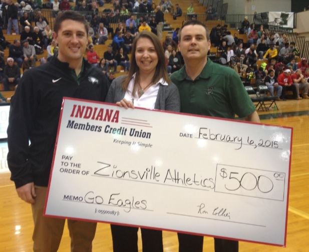 Kathleen Kennedy Duckwall (center) of IMCU presents a check to David Lang (left), ZCS assistant athletic director, and Greg Schellhase, ZCS athletic director. (Submitted photo)
