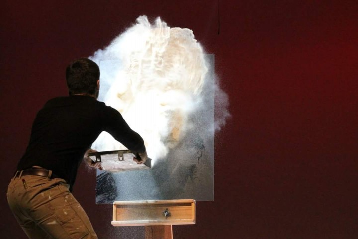 Michael Luse used rubber cement and sand to create a portrait of Marilyn Monroe during the Mr. Zionsville competition.