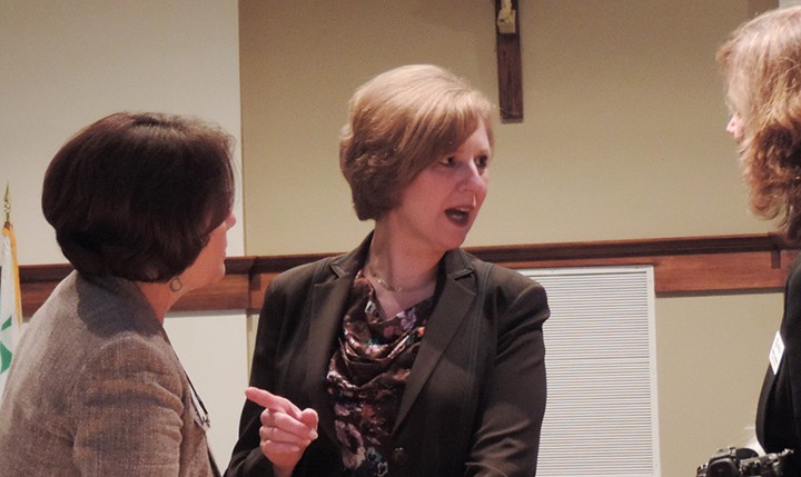 Rep. Susan W. Brooks (R-IN), discusses a point with a member of the audience at a recent presentation on persecution of Christians in the Middle East. The forum was held at St. Alphonsus Liguori Catholic church in Zionsville. (Photo by Anthony Kaufmann)
