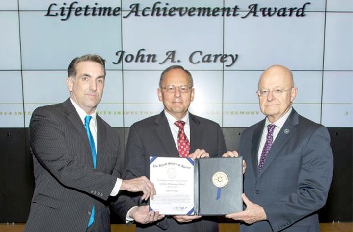 John Carey, center, was recently awarded the Intelligence Community Inspector General Lifetime Achievement Award by the Honorable I. Charles McCullough, III, the Intelligence Community IG, left, and the Honorable James R. Clapper, director of National Intelligence. (Submitted photo)