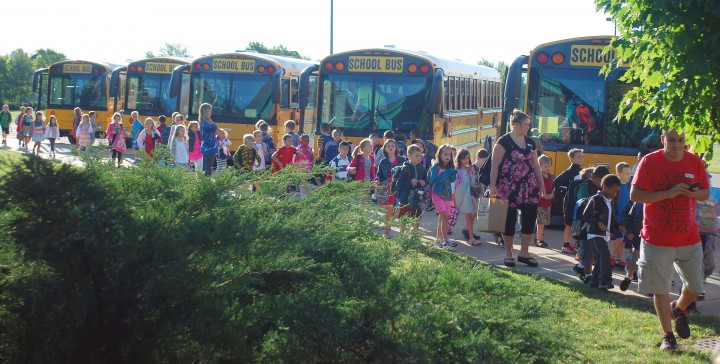 School buses drop students off at Carey Ridge Elementary on the first day of school. A new pilot program will provide Westfield Washington Schools with six buses equipped with seatbelts in the next two to three years. (File photo)