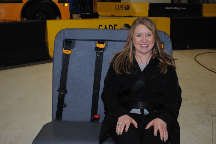 Westfield Washington School Board Member Amber Willis tests out the school bus seat. (Photo by Mark Ambrogi)