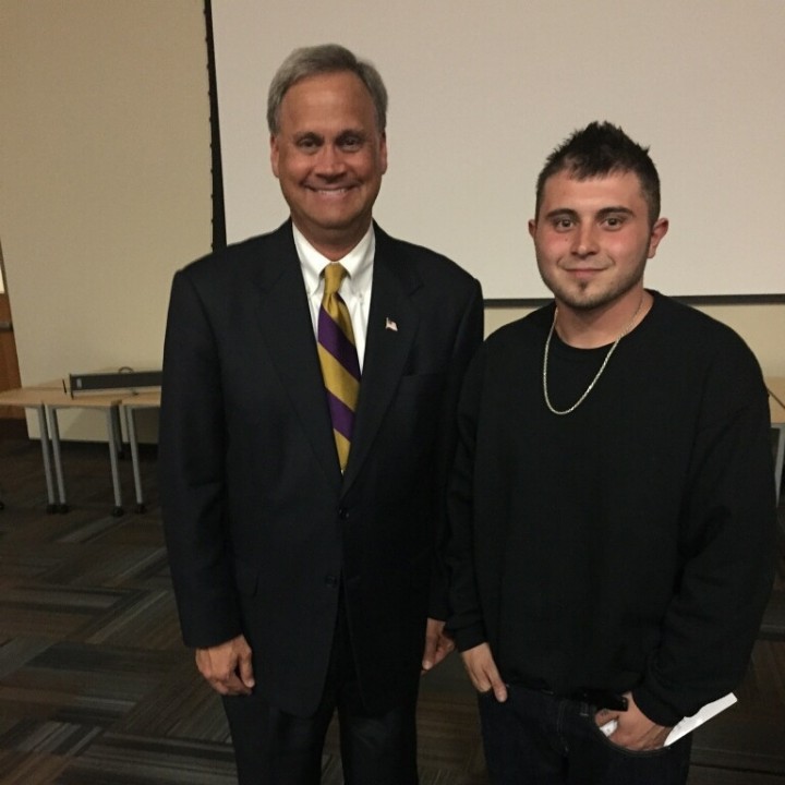 Brandon Villa, 23, right, a recovering addict, stands with Senator Jim Merritt. (Submitted photo)