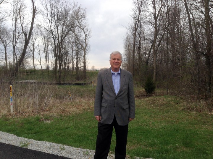 Mayor Andy Cook in front of where the Anna Kendall Bridge will be built. (Photo by Anna Skinner)