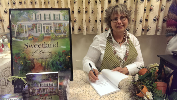 Photo by Heather Lusk  Author Donna Cronk signed copies of her novel at a special event to promote the Hussey-Mayfield Memorial Public Library’s upcoming author fair.