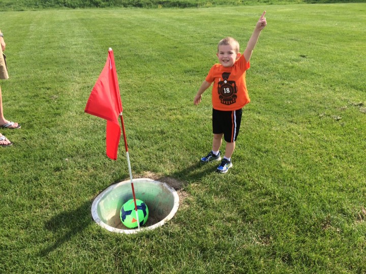 Cooper Williams celebrates his successfull shot at the Wood Wind Footgolf course. (Photo by Michelle Williams)