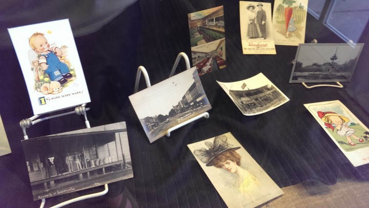 Dozens of Harley Sheets’ postcards are on display at the Hussey-Mayfield Memorial Library. (Photo by Heather Lusk)