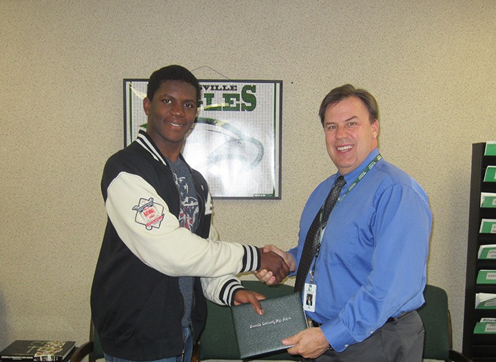 ZCHS principal Tim East congratulates Bryan Wilson on his achievement. (submitted photo) 
