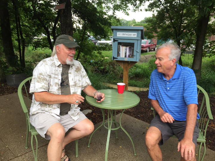 Steve Miller, landscape impressionist and Plein Air Painters’ Association member, and Mayor Andy Cook brave the on-and-off rain and enjoy their time outside at the event. (Photo by Anna Skinner)