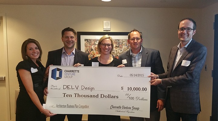 DELV Design partners Amanda Welu, from left, Jeremy Welu, Cara Weber and Chris Lake accept a $10,000 prize from Matt Ostanik of the Charrette Venture Group. (Submitted photo)