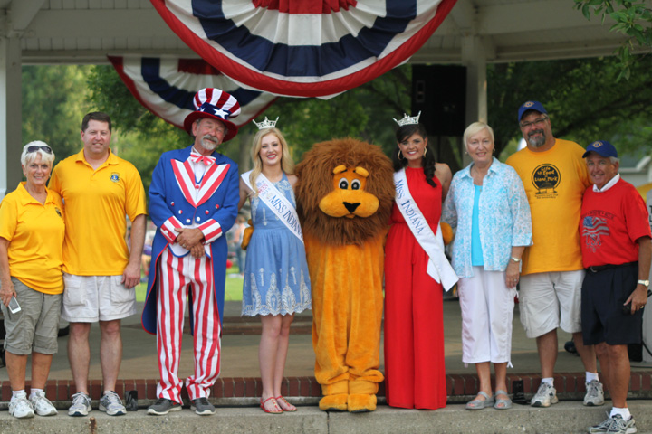 Opening ceremonies for the Lions Club 4th of July celebration at Lions Park. From Left to Right, Cheri McKamey, Tim Reinhart, Uncle Sam, Miss Indian Outstanding Teen Alyssa Hochstetlyer, The Lions Club Lion, Miss Indiana Morgan Jackson, Linda Johnson, Steve Gayheart, and Darryl Johnson. (Photo by Keith Shepherd)
