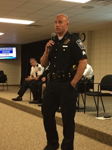 Fishers Police Department’s Tom Weger speaks to residents on burglary prevention safety measures.