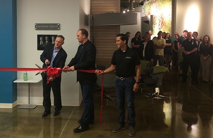 Jarden Home Brands CEO Chris Scherzinger, left, Fishers Mayor Scott Fadness and Jarden Home Brands President Troy Shay cut the ribbon at their new facility at 9999 E. 121st St. (Submitted photo)