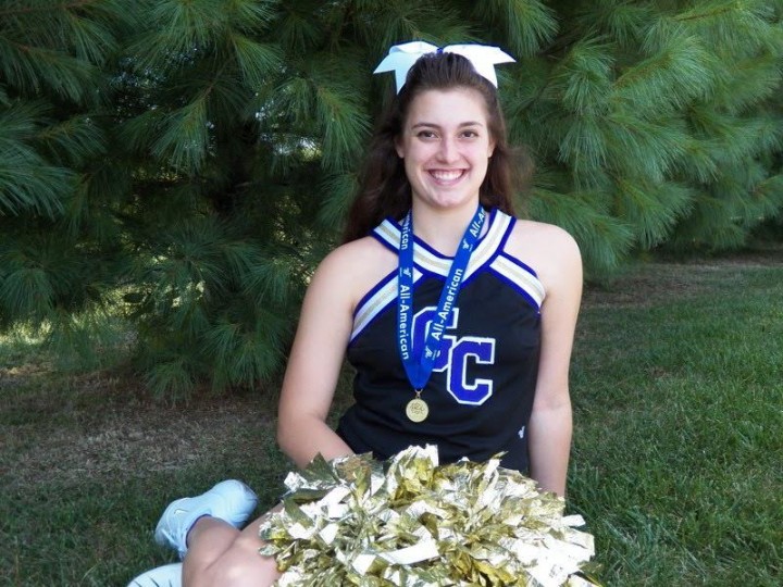 Sarah Downing, a varsity cheerleader for foot- ball and basketball, began cheering in fourth grade. (Submitted photo)