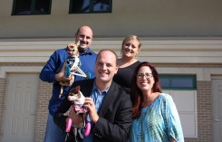 Ray Hurt and Ashley Looper, from back, with Fishers Mayor Scott Fadness and Hamilton County Humane Society Executive Director Rebecca Stevens with pups Turbo and Ruby Roo. (File photo)