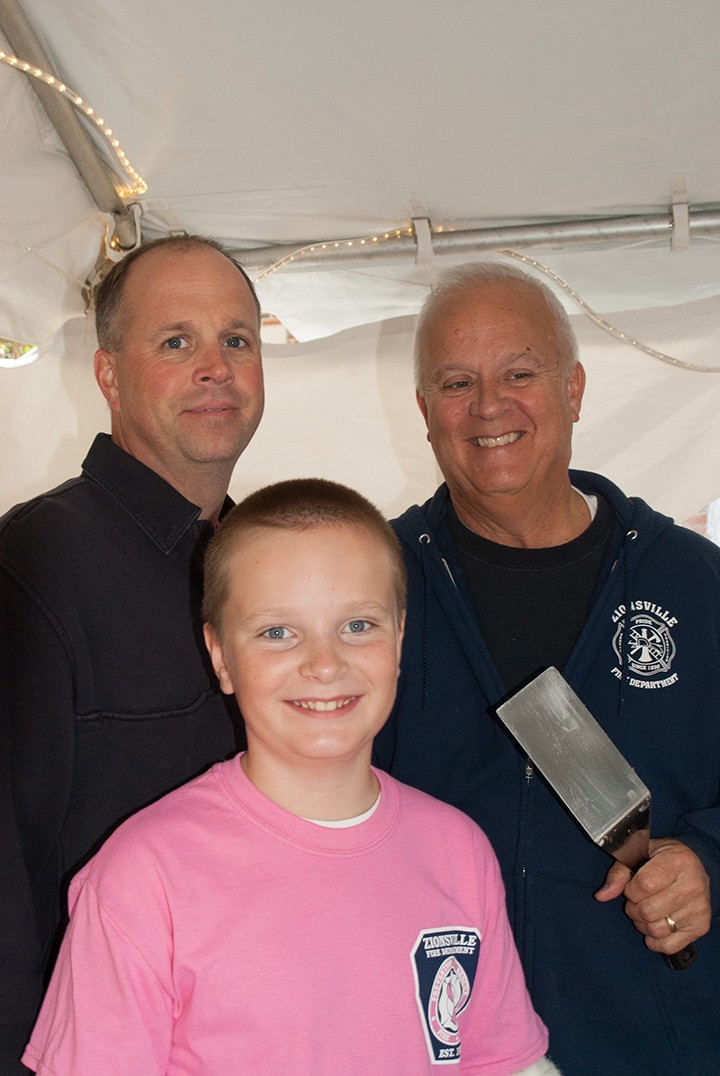 Deputy Chief Brian Miller, from left, Luke Miller and ZFD retiree Don Miller are three generations that helped with the 2014 ZFD Pancake Breakfast. (Submitted photo)