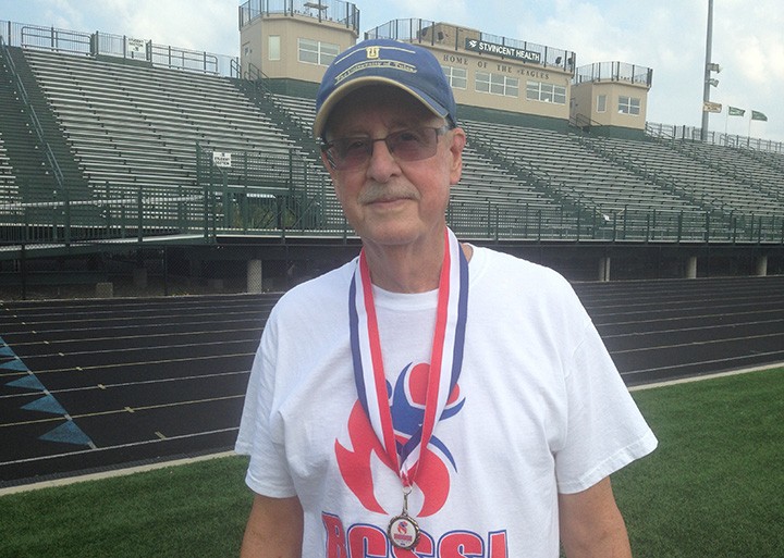 Duane Kyler displays a medal he won in the BCSSI Olympics. (Photo by Mark Ambrogi)