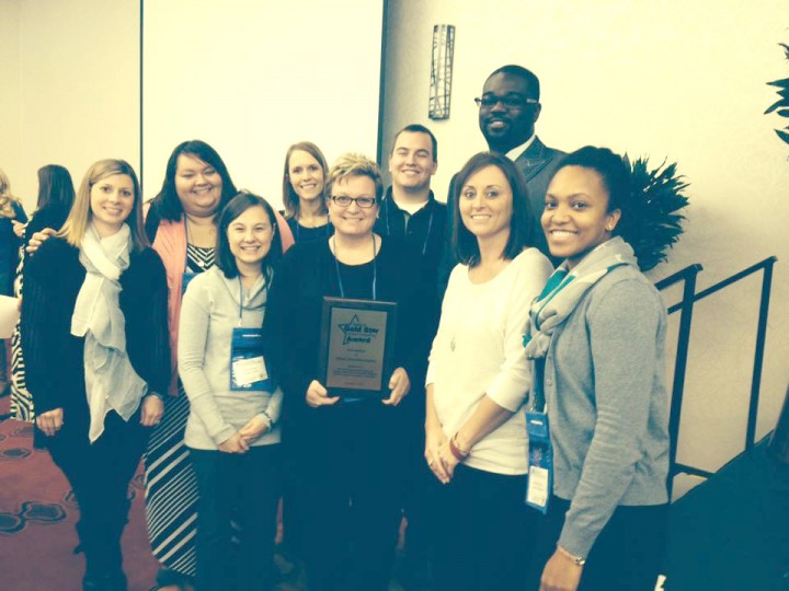 From left: Lauren Gross, Jessica Briones, Sonia Norman, Jennifer McClimon, Melissa Brown, Curt Oechsle, Brandon Currie, Angela Spoljaric and Jeniece Fleming celebrate INCA’s Indiana Gold Star School Counseling Award, which they also received from ASCA for its counseling program. (Submitted photo)