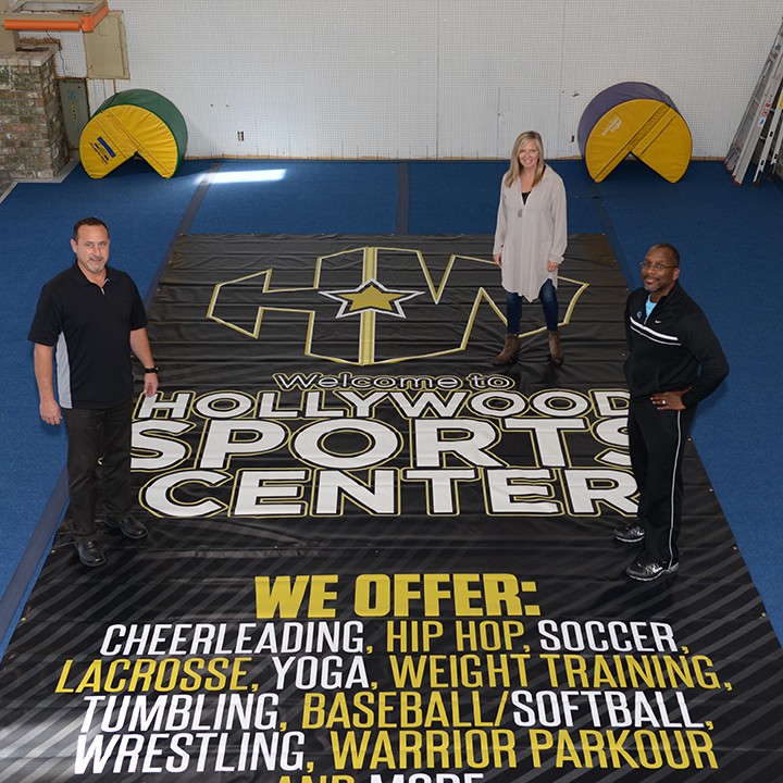 John Kirk, Margi Beaver and Patrick Cowherd inside the new Hollywood Sports Center. (Photo by Theresa Skutt)
