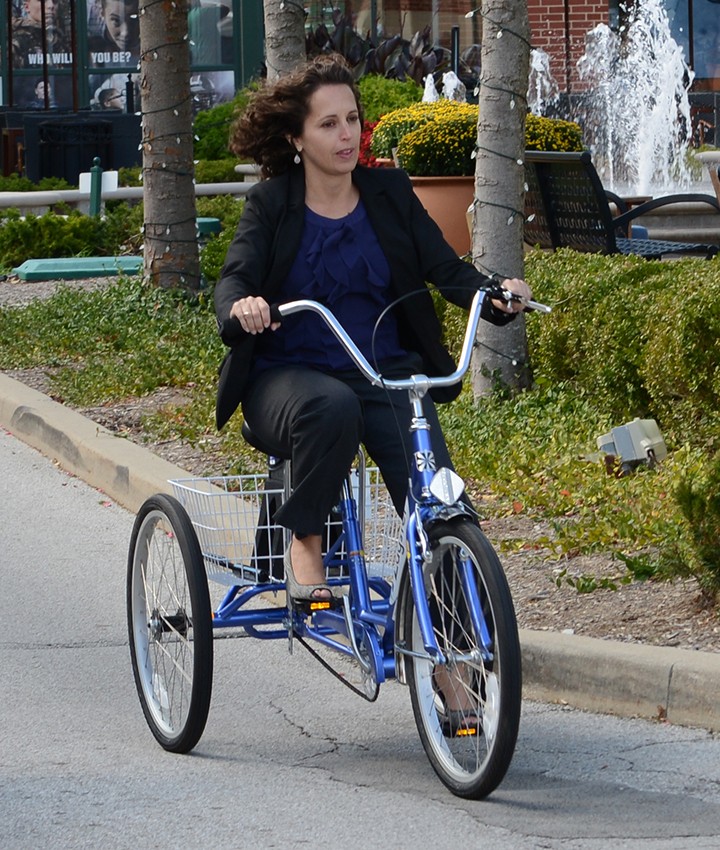 Jennifer Jones take the bikes for a spin around Clay Terrace Boulevard. (Photo by Theresa Skutt)