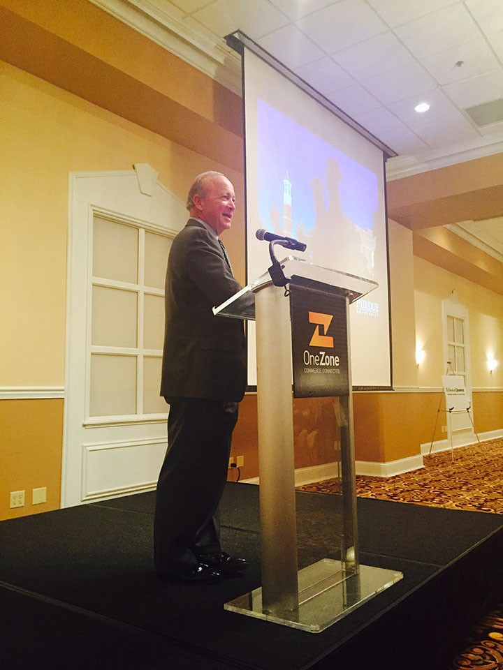 Mitch Daniels speaks to a crowd of OneZone members in Carmel Oct. 22. (Photo by Adam Aasen) 