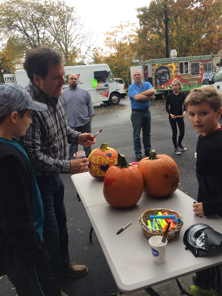 Ted, Zachary and William Spurgeon of Cicero at the pumpkin-decorating table. (Photo by Kayla Nakeeb)