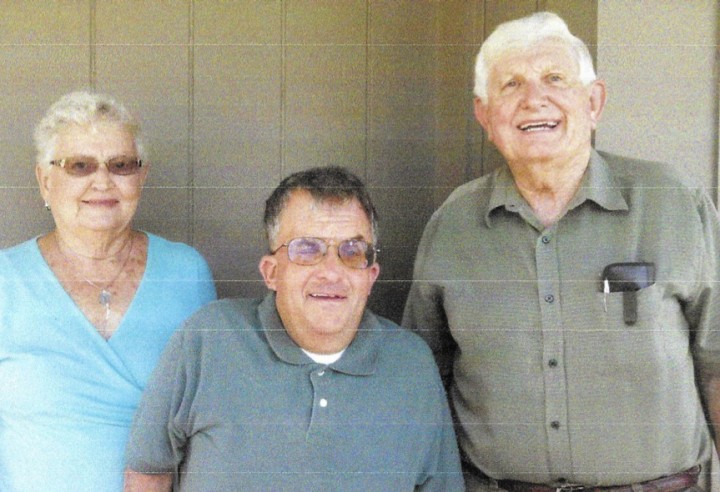 Doug Dolen, center, was one of the first students in College Wood’s special education program. Former teacher Connie Hunt, left, and former principal Jim Moore were instrumental in the program. (submitted photo)
