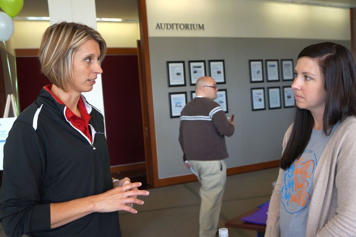 Kami Reuter, a wellness consultant at CNO, speaks to employees at the health event Oct. 20. (Photo by Audrey Bailey)