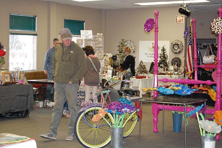 Guests check out items at the 2014 Recycled Art Market. (Submitted photo)