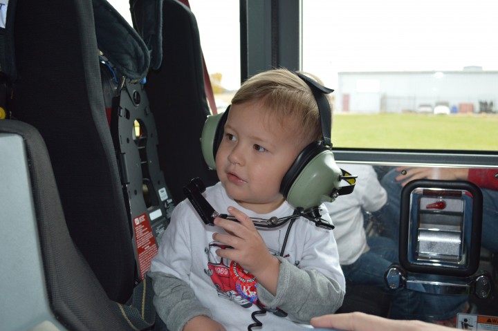 Carter Crouch, 3, enjoys the view from inside a fire truck to celebrate his third birthday. (submitted photo)