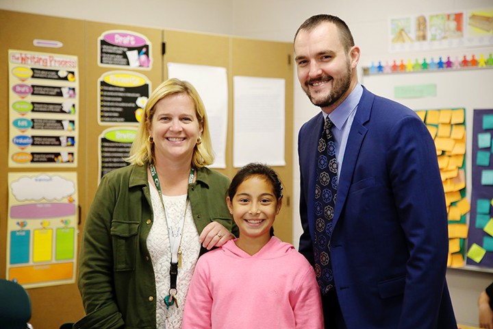 Zionsville Middle School 6th grade teacher Emily Wleklinski, left, won Current’s Teacher of the Month honor for October. Student Hanna Wilhite nominated her. Jason Riley of Market District presented Wleklinski with a gift card. (Photo by Feel Good Now)