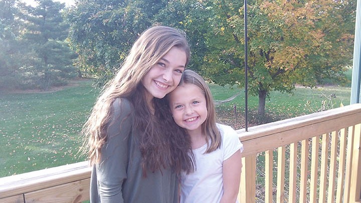 Cynthia Kauffman, 15, and sister Claire Kauffman, 9, are both performing in professional theater productions for the first time this fall. (Submitted photo)