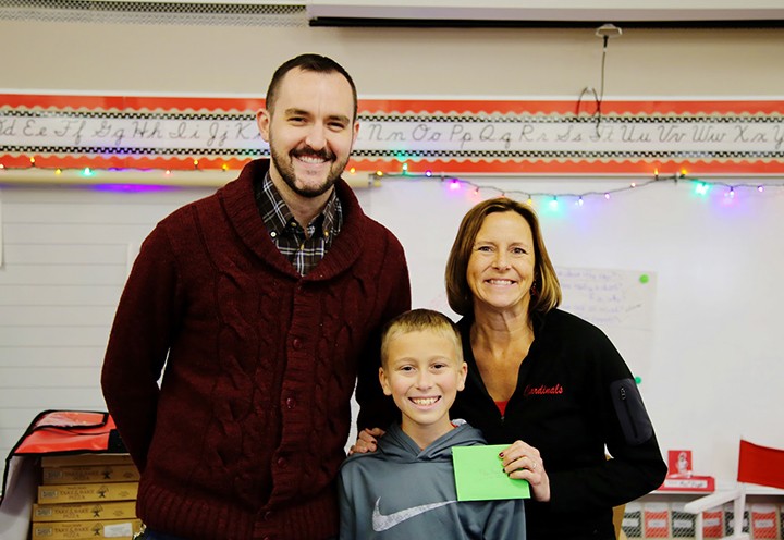 From left, Market District’s Jason Riley, fourth-grade student Evan Thomas and teacher Agnes Pugel. (Photo by Rachel Greenberg)