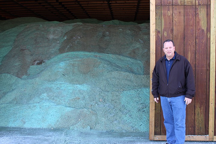 Department of Public Works Director Eric Pethtel in front of the DPW’s salt reserves in its newly constructed barn. The new salt barn holds nearly seven times the amount of salt the DPW’s previous barn held. (Photo by James Feichtner)