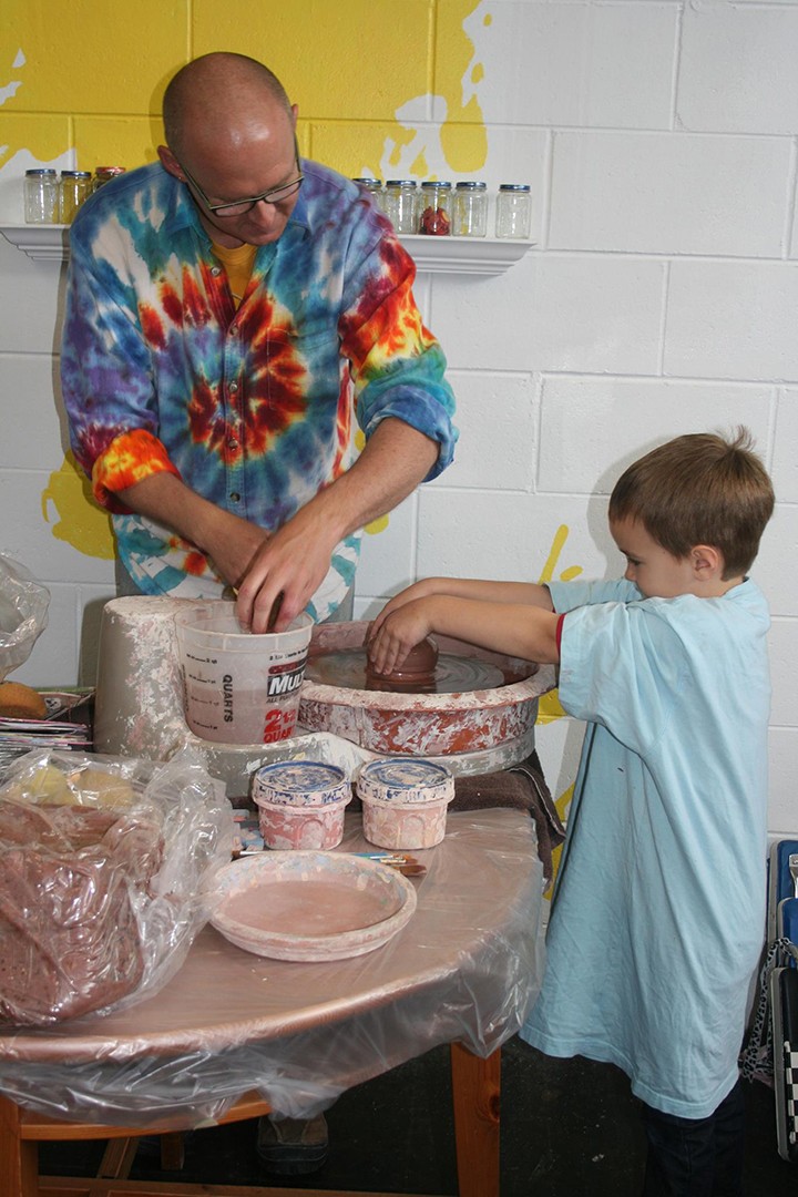 Jeremy South, left, helps a student at The Art Lab. (Submitted photo)