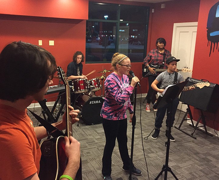 Fishers School of Rock students rehearse for their upcoming Jan. 23 concert at Alley’s Alehouse. From left, guitarist Devon Lehr, drummer Simon Gardner, vocalist Maggie Adolay, bassist Kaia Eby- Holmes and guitarist Keegan Phillips. (Submitted photo)