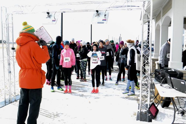 Runners at the 2015 Melt the Trail 5K Run prepare to start their race in the snowy weather. (Submitted photo)